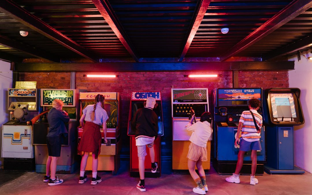 Players at a colorful amusement arcade